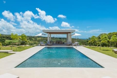 Stunning views from the pool and modern gazebo seating area, looking out over the horizon.