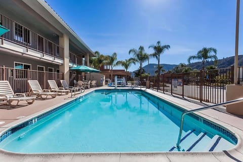 Dive into a sparkling pool with sunny mountain views.