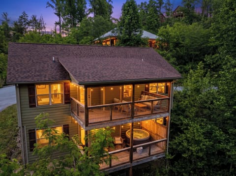 Twilight view of the back of the cabin.