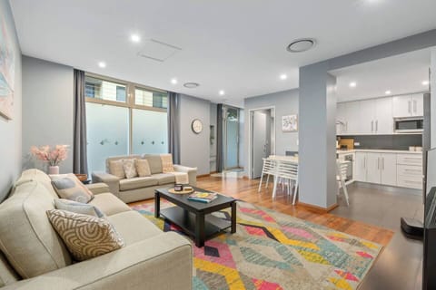 Stretch out across bright open-plan interiors where the living, dining, and kitchen spaces flow together for easy mornings and relaxed evenings in the heart of Pyrmont.
