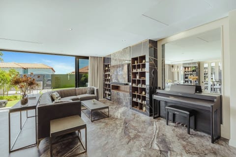 Opal Sky Residence features a spacious open-concept living area with elegant designer furnishings, a gourmet kitchen, and floor-to-ceiling windows creating a bright and luxurious atmosphere.Opal Sky Residence features a spacious open-concept living a