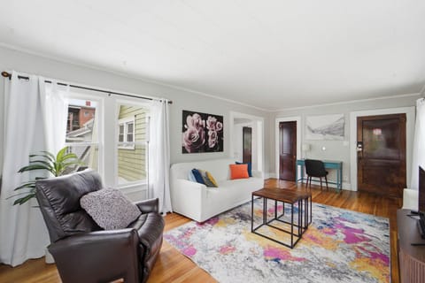 Spacious lounge with natural light and comfortable seating seating