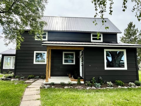 The 1915 farmhouse front porch is waiting to greet you. 