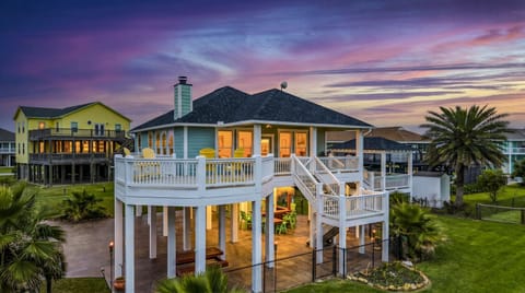 Welcome to The Tiki Tide House—where glowing sunsets and coastal nights set the mood instantly.