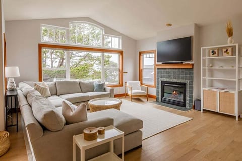 Bright and inviting upstairs living space designed for gathering after beach days