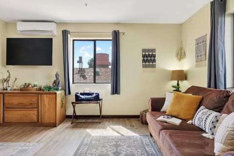 Stretch out in the cozy lounge area featuring a queen sleeper sofa and scenic Sedona red rock views just outside the window.