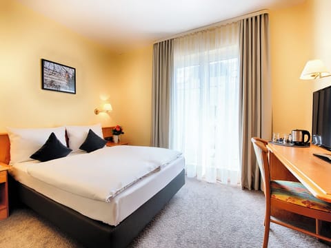 Settle into crisp linens and a calm, restful atmosphere.