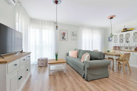 Bright living room with open kitchen and dining area