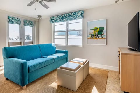 Soak up sunshine in the airy lounge with calming decor.