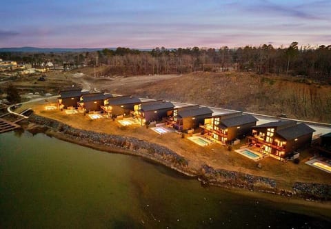 An aerial perspective shows the row of homes along the shoreline, each with easy access to the water and scenic surroundings.