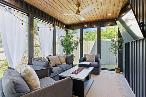 Gather around the fire table, stream your favorite shows, and enjoy Nashville nights from this cozy screened retreat.