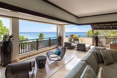 The peaceful verandah space contains various and unique seating arrangements, ceiling fans for a cooling breeze and the most stunning views over Paynes Bay.