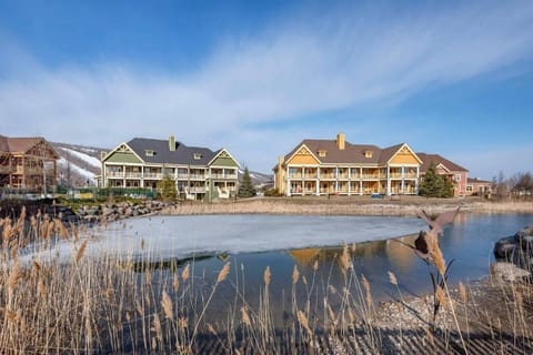Breathe in crisp lake air with peaceful resort views.