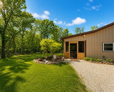 Peaceful woodland cabin retreat with spacious yard, modern comforts, and private nature views—perfect for relaxing getaways and outdoor adventures.