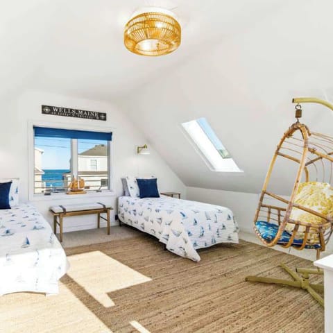 The loft is ideal for an afternoon snooze, offering a pair of twin beds & a cozy egg chair​