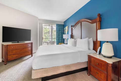 Wake up refreshed in a serene bedroom with balcony views.