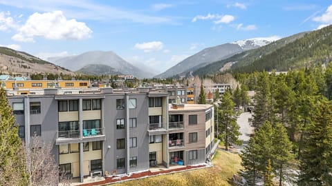 Mountain resort property nestled in a scenic alpine valley with stunning mountain views and forested surroundings.