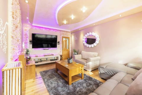 Stylish living room with ambient lighting, cozy seating, modern decor