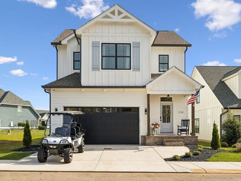 Front view of home with golf cart