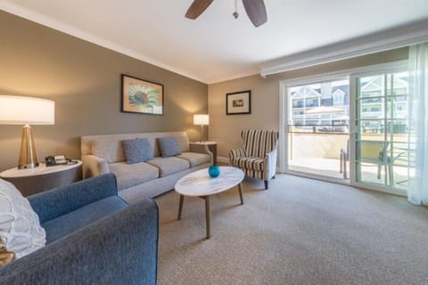 Lounge comfortably by the sunlit balcony after a day out.