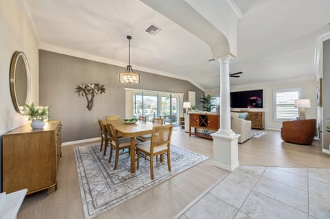 Open Floorplan w/ New Furnishings. Natural Light From Glass Sliders Spill into the Formal Dining for 6x & Cozy Lush Living Room. 