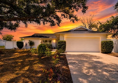 Golden Gulf Coast sunsets steal the show, casting warm light over the home, whil