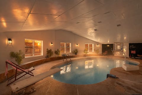 Private indoor pool with warm lighting for year-round relaxation