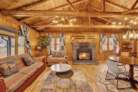 Spacious great room with soaring ceilings, cozy fireplace, and open-concept living perfect for gathering with family and friends.