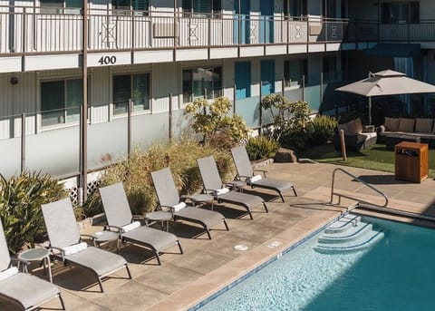 Stretch out in the sun with serene poolside seating.