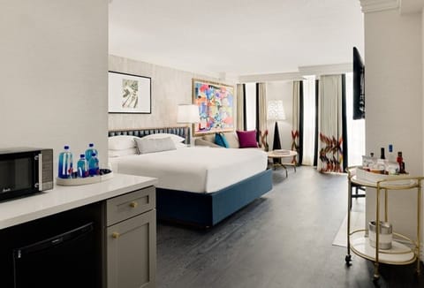 Settle in with snacks and drinks in your airy suite.