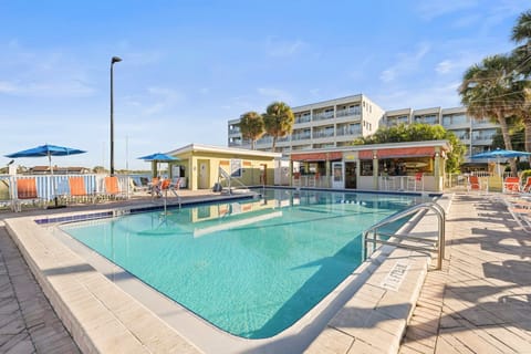 Splash into relaxation with a refreshing swim in the pool, surrounded by inviting lounge chairs.