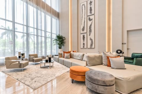 Relax in the elegant lounge area, surrounded by natural light and chic decor.