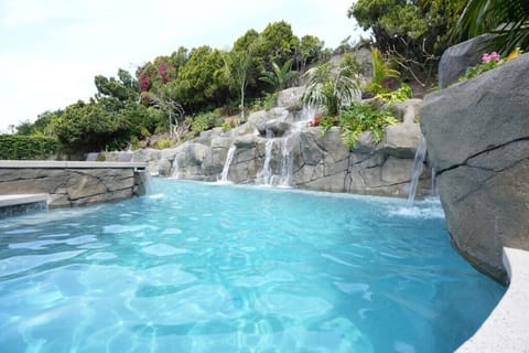 Serene Oasis with In-ground Rock Pool and Jacuzzi with Waterfall Feature