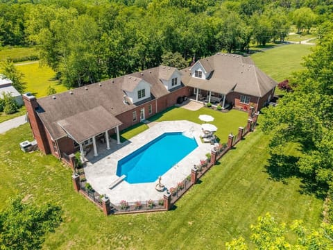 Enjoy luxury-country living on this peaceful Franklin estate, complete with a private pool, barn and pasture, firepit, outdoor furniture, covered patio and so much more!