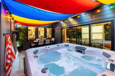 Unwind under colorful lights in the hot tub after a night in Nashville.