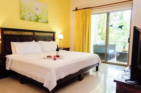 Master bedroom with king size bed, closet and full bathroom