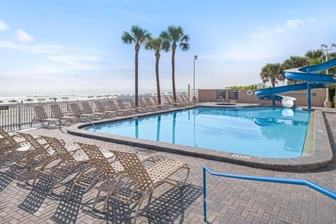 Dive into sunlit swims with an exciting waterslide escape.
