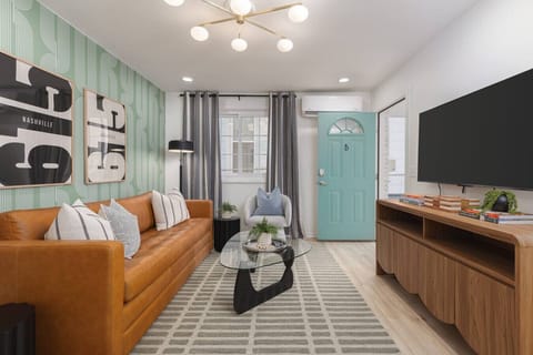 Comfortable, cozy living room with lots of natural light! Smart TV with all the apps you could want + comfortable seating, including a queen sized sofa bed.