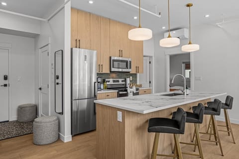 007_canmore-vacation-rental-kitchen-island-bar-stools-stainless-appliances