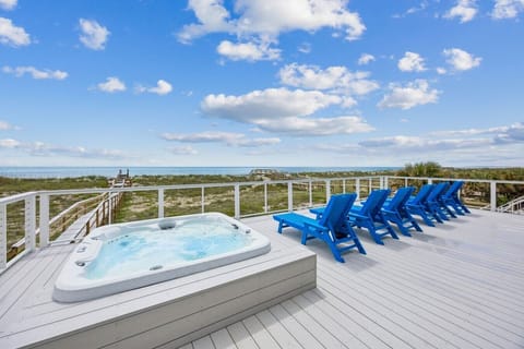 Large deck off living/dining rooms with hot tub and spectacular ocean views