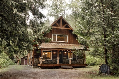 Cozy forest cabin with a welcoming porch and peaceful setting