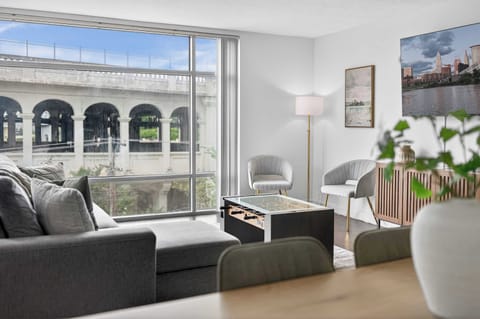 Bright seating area with stunning arched-window views and natural light perfect for slow mornings and peaceful city vibes.