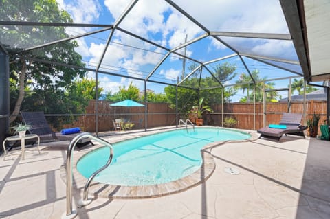 Private screened-in pool oasis perfect for relaxing under the Florida sunshine.