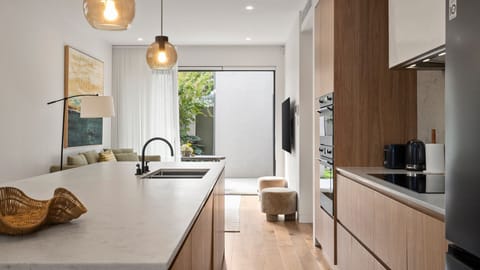 ully equipped modern kitchen with quality appliances and ample bench space