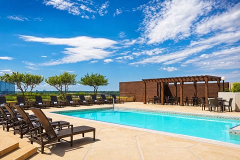 Dive into sunshine with loungers and serene resort vibes.