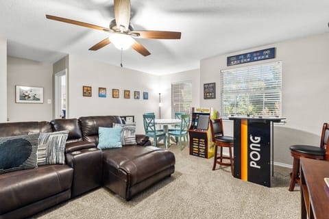 Private cinema and game room featuring a large-screen HD display and classic Pac-Man arcade, perfect for relaxing and having fun with the group.