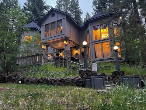 Private woodland retreat with glowing windows and lodge-style charm