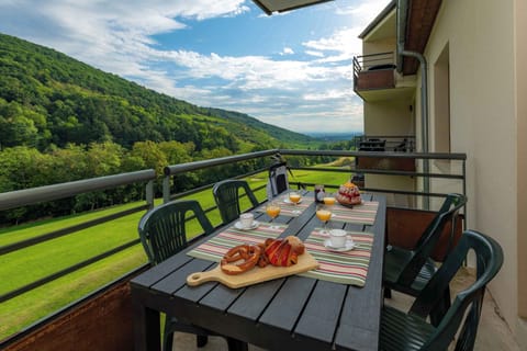 Wake up to green hills and breakfast on the balcony — the perfect start to a day exploring the Alsace Wine Route.