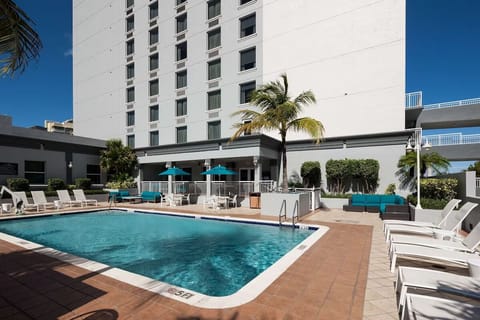Soak up the day beside palm trees and calm blue water.