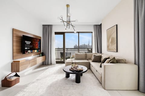 Living room with smart TV and Burj Khalifa view